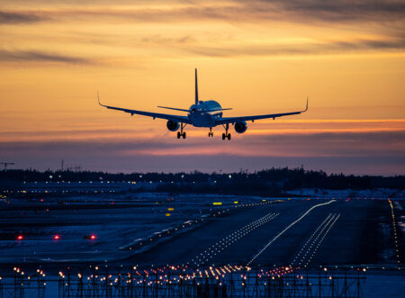 Plane taking off in sunset
