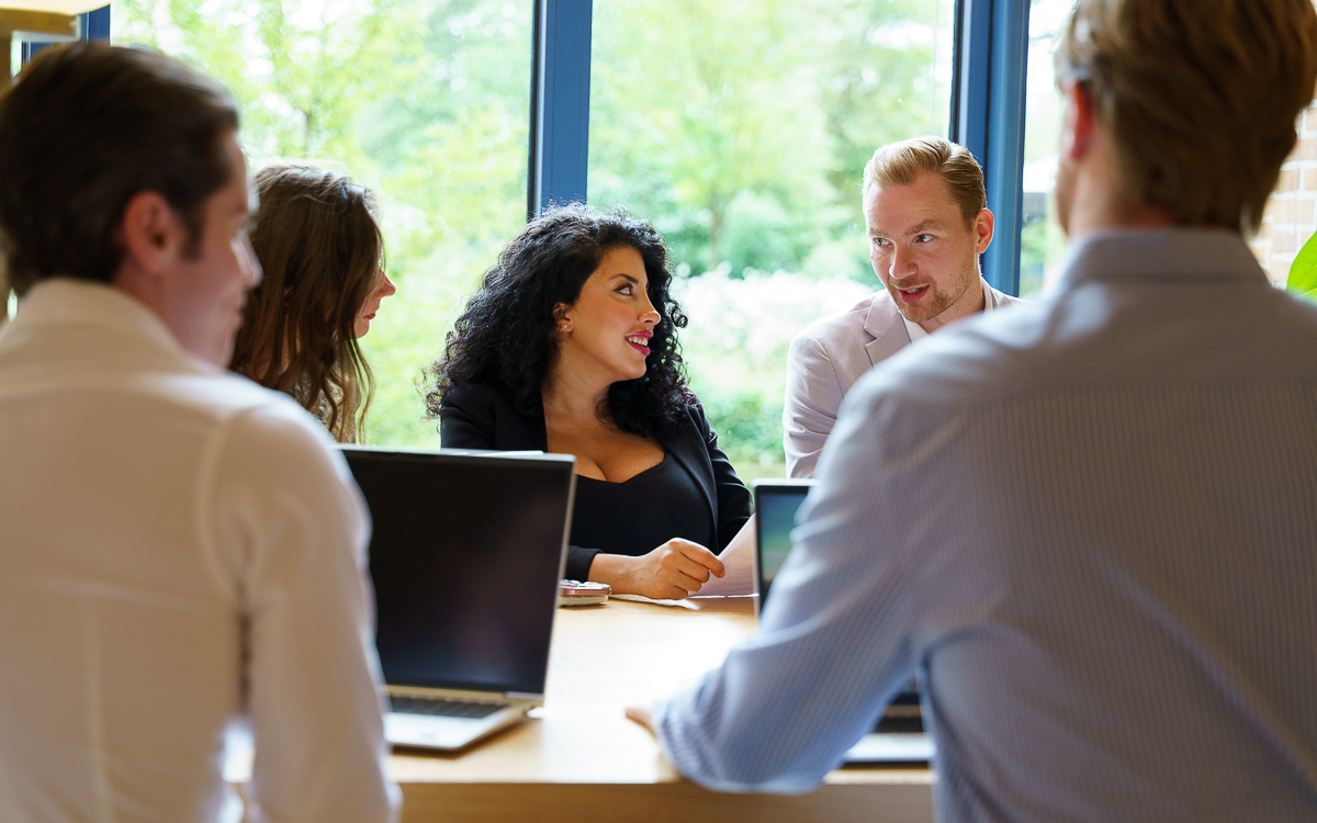 Levy Global team discussing software development candidates.